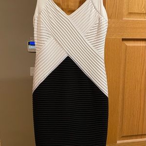 Beautiful Calvin Klein scuba dress….super flattering with stretch. Worn once.